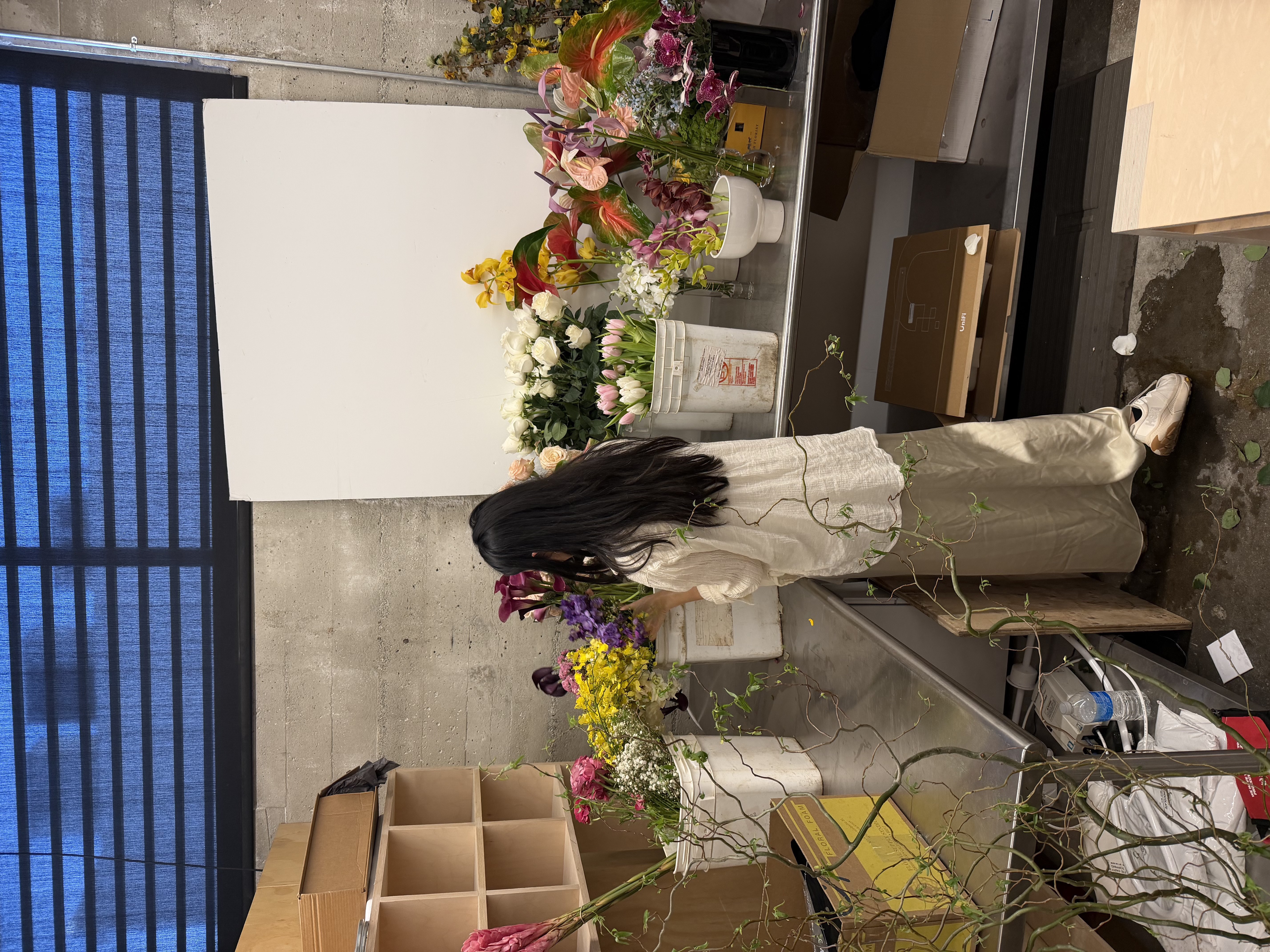 Elaine arranging flowers in the studio
