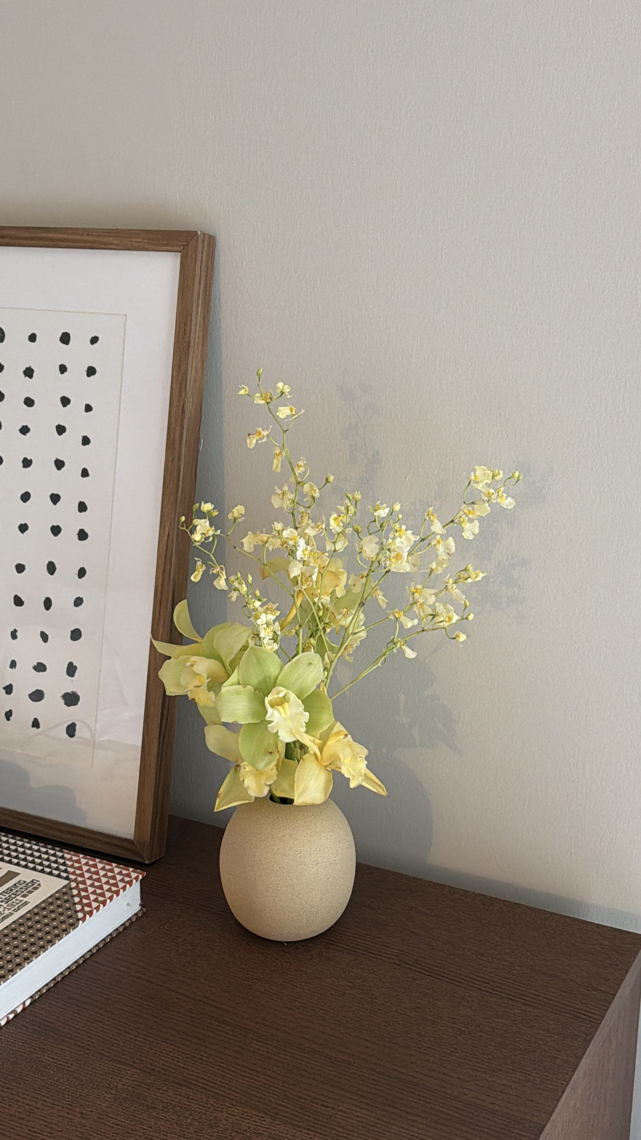 Yellow cymbidium and oncidium orchid arrangement